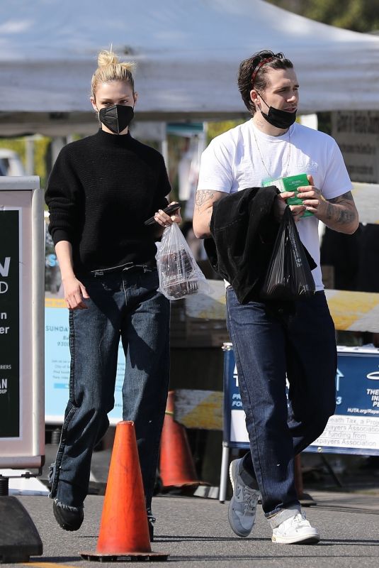 NICOLA PELTZ and Brooklyn Beckham Out at Beverly Hills Farmers Market 03/13/2022