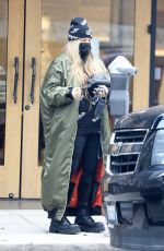 STACY FERGIE FERGUSON Feeds a Parking Meter in Los Angeles 01/19/2022