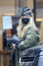 STACY FERGIE FERGUSON Feeds a Parking Meter in Los Angeles 01/19/2022