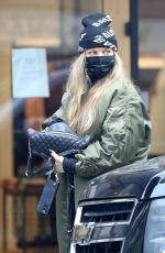 STACY FERGIE FERGUSON Feeds a Parking Meter in Los Angeles 01/19/2022