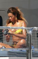 BEYONCE in a Yellow Bikini at a Yacht in Monaco 05/15/2007