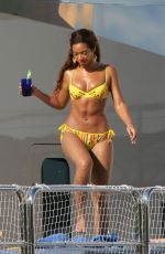 BEYONCE in a Yellow Bikini at a Yacht in Monaco 05/15/2007