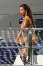 BEYONCE in a Yellow Bikini at a Yacht in Monaco 05/15/2007