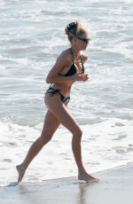 CHARLOTTE MCKINNEY in Bikini at a Beach in Santa Monica 04/24/2022