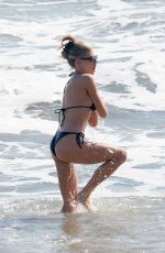 CHARLOTTE MCKINNEY in Bikini at a Beach in Santa Monica 04/24/2022