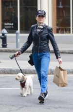 JULIANNA MARGUILES Out with Her Dog in New York 03/31/2022