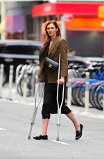 KARLIE KLOSS Walkong on Crutches Out in New York 04/05/2022