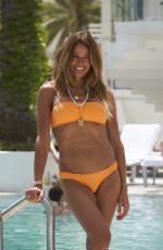 KELLY BENSIMON in Bikini at a Beach in Miami 04/23/2022