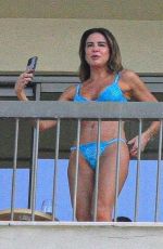 LUCIANA GIMENEZ in Bikini on Balcony of Her Hotel in Rio de Janeiro 04/22/2022