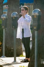 LUCY HALE Feeds Her Parking Meter in Studio City 04/09/2022