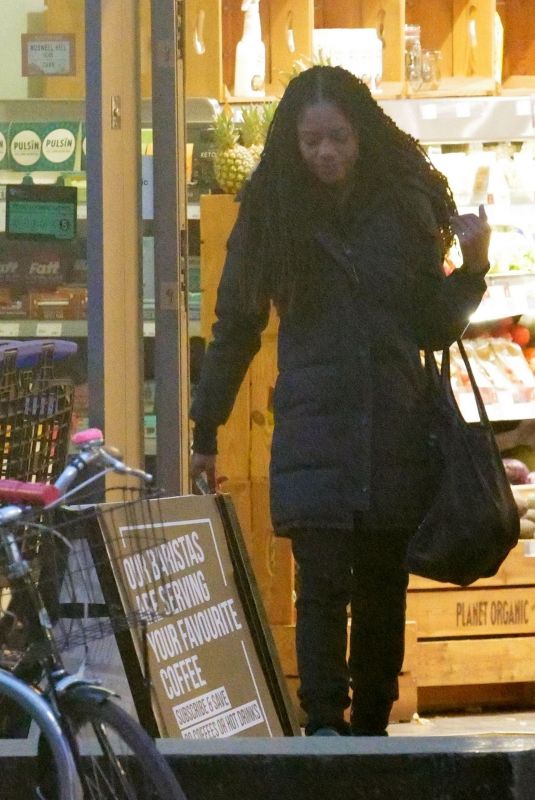 NAOMIE HARRIS Shopping at Planet Organic in London 03/30/2022