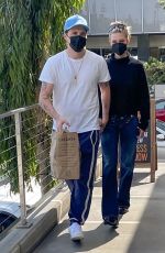NICOLA PELTZ and Brooklyn Beckham Shopping at Erewhon Market in Santa Monica 04/25/2022