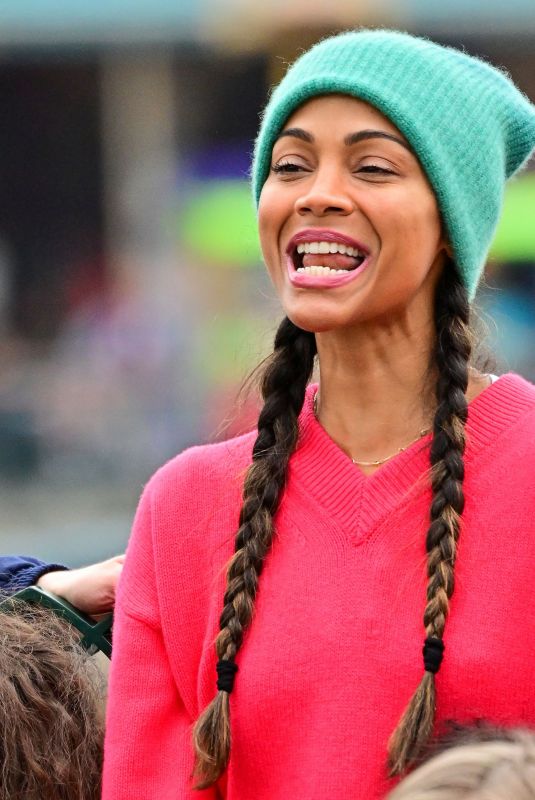 ZOE SALDANA Out in Disneyland 04/02/2022