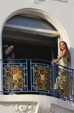ALESSANDRA AMBROSIO on the Balcony of Her Hotel at a Photoshoot in Cannes 05/20/2022