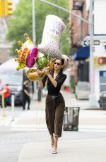 BELLA HADID Out Picks up Some Balloons in New York 05/20/2022