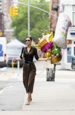 BELLA HADID Out Picks up Some Balloons in New York 05/20/2022