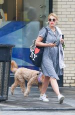 BUSY PHILIPPS Out with Her Dog in New York 05/29/2022