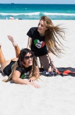 CLAUDIA ROMANI and LUCIA LUCIANO in Bikinis at a Beach in Miami 05/30/2022