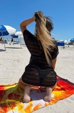 CLAUDIA ROMANI in Bikini at a Beach in Miami 05/15/2022