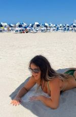 CLAUDIA ROMANI in Bikini at a Beach in Miami 05/15/2022