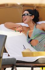 DUA LIPA in Bikini under a Sheer Cover-up at a Beach in Miami 05/02/2022