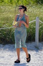 DUA LIPA in Bikini under a Sheer Cover-up at a Beach in Miami 05/02/2022
