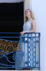 ELLE FANNING at Balcony of Hotel Martinez at Cannes Film Festival 05/19/2022