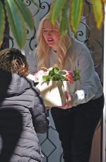 ERIKA JAYNE Picks up a Flower Delivery Outside Her Home in Los Angeles 05/11/2022
