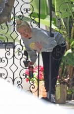ERIKA JAYNE Picks up a Flower Delivery Outside Her Home in Los Angeles 05/11/2022