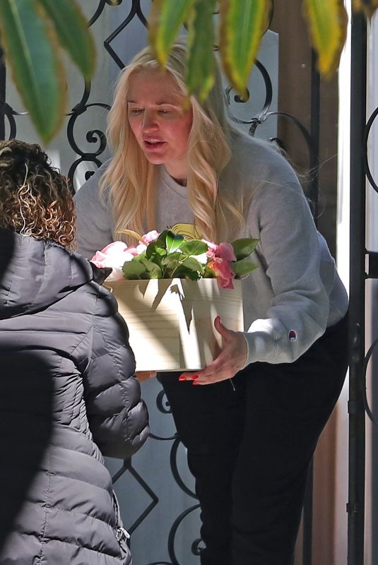 ERIKA JAYNE Picks up a Flower Delivery Outside Her Home in Los Angeles 05/11/2022