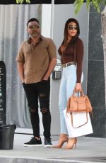 HOLLY SONDERS and Oscar De La Hoya Out in Beverly Hills 05/27/2022