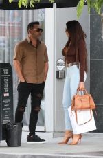 HOLLY SONDERS and Oscar De La Hoya Out in Beverly Hills 05/27/2022