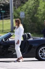 KELLY BENSIMON Checks Out a Porsche on Her 54th Birthday in New York 05/01/2022