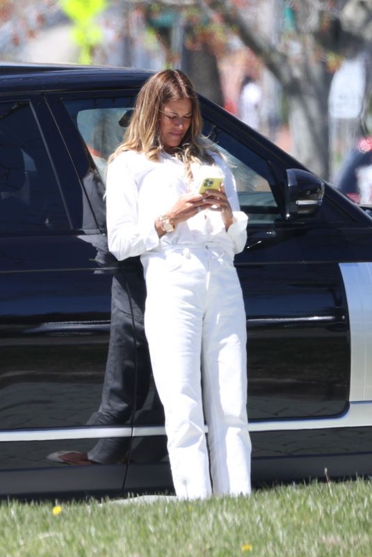 KELLY BENSIMON Checks Out a Porsche on Her 54th Birthday in New York 05/01/2022