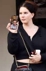 LANA DEL REY with Her Sister CAROLINE GRANT and friend Jason Pickens Out Shopping in Portofino 05/11/2022