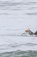 LEIGHTON MEESTER and Adam Brody at a Surfing Session in Malibu 05/10/2022