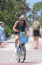 LINDSEY VONN and Diego Osorio Out on a Bike Ride in Miami Beach 05/09/2022