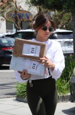 LUCY HALE Picking up Some Packages at UPS Store in Los Angeles 05/27/2022