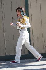 LUCY HALE Riding a Bike on a Movie Set in Los Angeles 05/08/2022