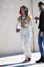 LUCY HALE Riding a Bike on a Movie Set in Los Angeles 05/08/2022