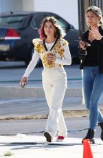 LUCY HALE Riding a Bike on a Movie Set in Los Angeles 05/08/2022