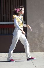 LUCY HALE Riding a Bike on a Movie Set in Los Angeles 05/08/2022