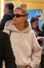 MOLLY MAE HAGUE and Tommy Fury at Heathrow Airport in Los Angeles 05/12/2022