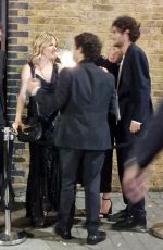 SIENNA MILLER Smoking Outside of a Charity Gala in London 05/05/2022