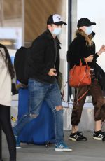 SUKI WATERHOUSE and Robert Pattinson at LAX Airport in Los Angeles 05/16/2022
