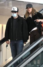 SUKI WATERHOUSE and Robert Pattinson at LAX Airport in Los Angeles 05/16/2022