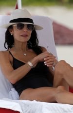 BETHENNY FRANKEL in a Black Swimsuit at a Beach in Miami 06/19/2022
