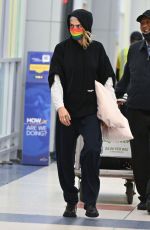 CARA DELEVINGNE Arrives at JFK Airport in New York 06/02/2022