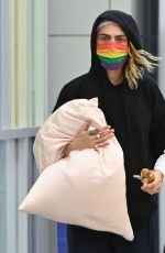 CARA DELEVINGNE Arrives at JFK Airport in New York 06/02/2022