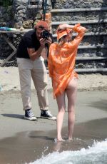 CARA DELEVINGNE at a Photoshoot in Paraggi 06/07/2022